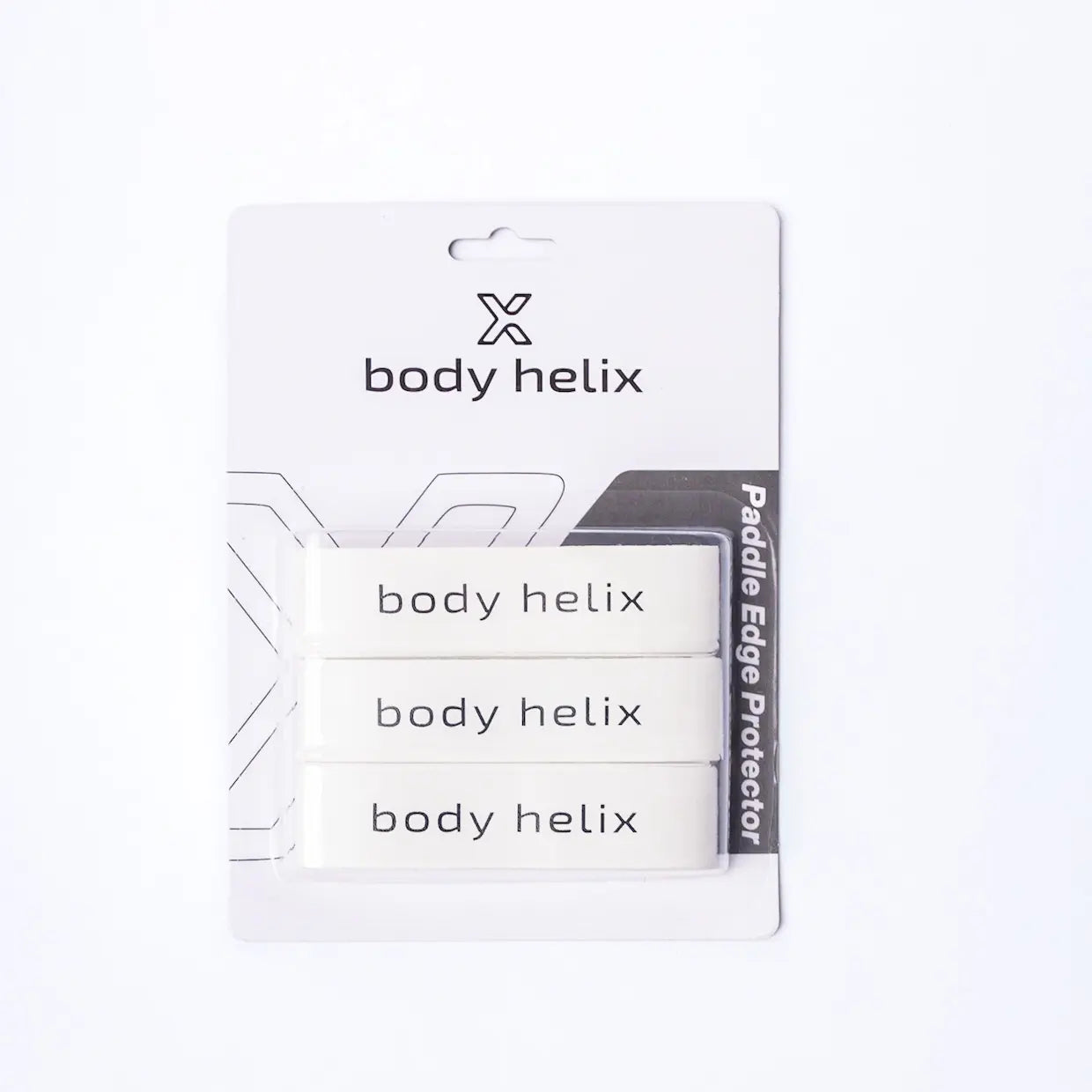 A retail pack by body helix includes three white rectangular Pickleball Edge Guard Tapes. The gray-accented packaging reads "Paddle Edge Protector" and features a hang tab, ideal for protecting your pickleball paddle's edge.