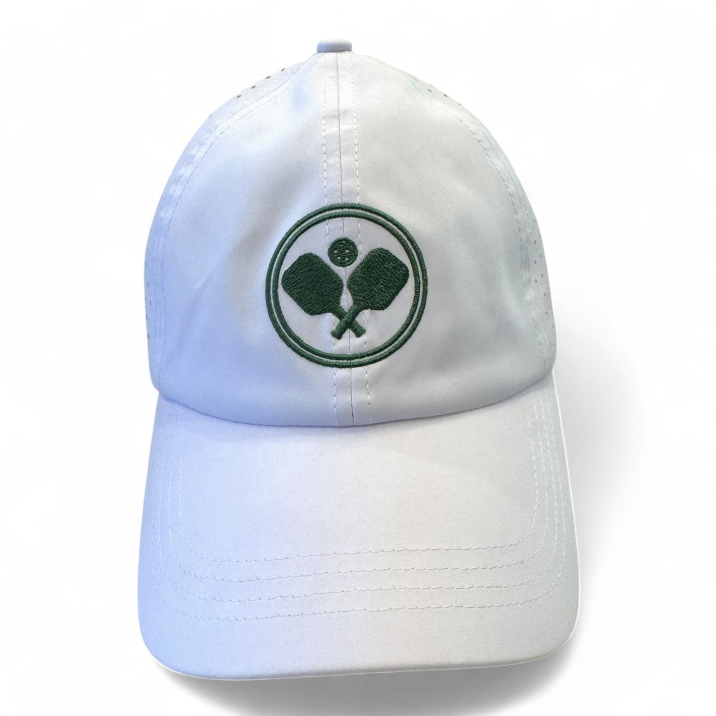Fresh Pickle Pickleball Caps: Women's white hat with a green embroidered logo of crossed paddles and ball in a double-ringed circle. This breathable sports cap is ideal for active days on or off the court. Plain white background.