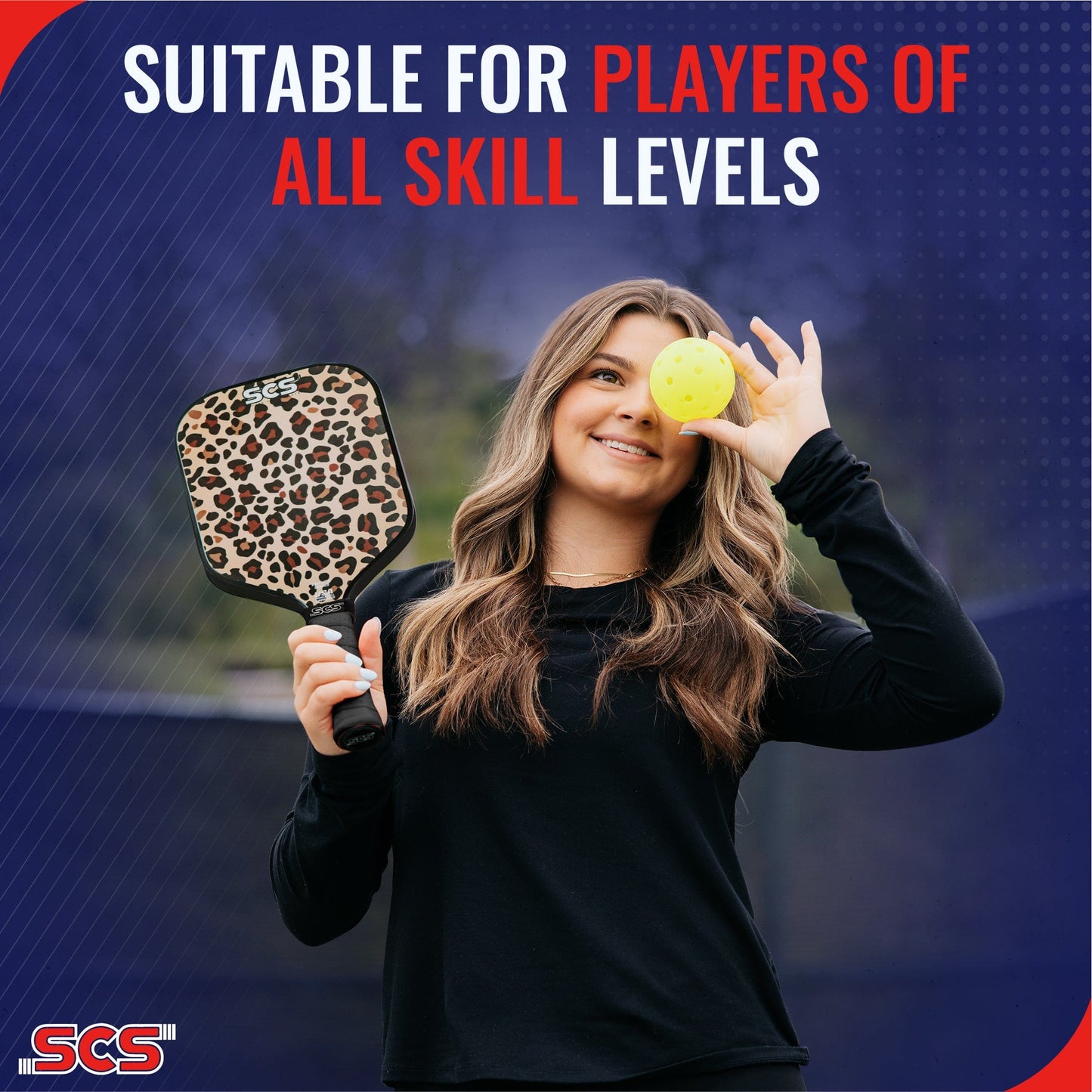 A smiling woman with long, wavy hair holds a Salted City Sports Leopard | Evo-Lite Series pickleball paddle and a yellow pickleball over one eye. Text: Suitable for all skill levels. USA Pickleball Approved. SCS logo in lower left corner.