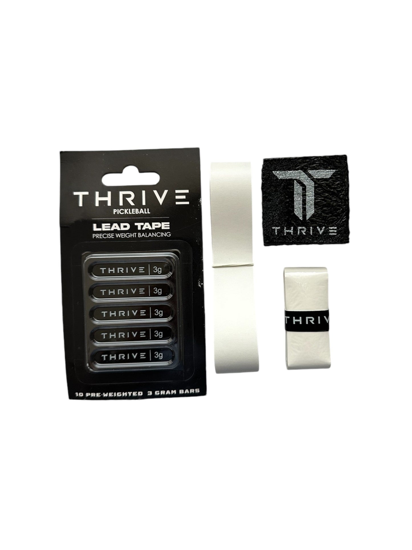 The image shows the Thrive Pickleball Maintenance Kit with five labeled 3g lead tape strips, two rolls of edge guard tape, a black cloth featuring the Thrive logo, and a white paddle eraser wrapped in a Thrive band.