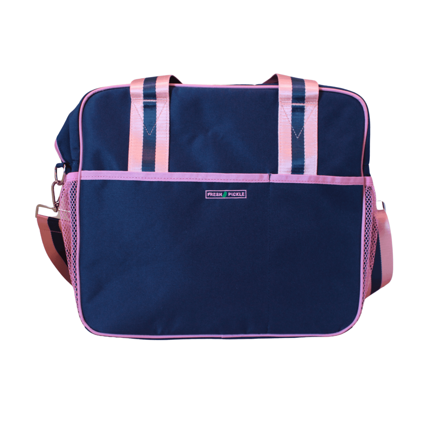 The Lola Pickleball Tote Bag by Fresh Pickle is a navy blue rectangular bag with light pink trim, pink mesh side pockets, and pink-and-blue striped handles and strap. Photographed on a white background.