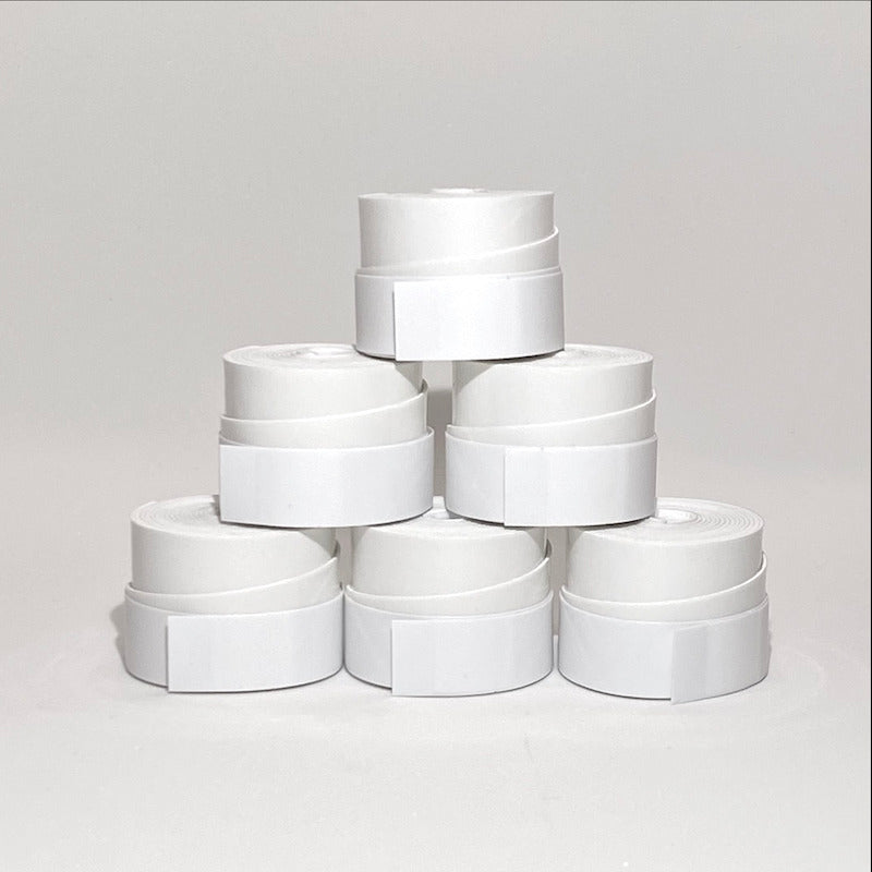 Six body helix Pickleball Paddle Overgrips are stacked in a pyramid against a white background. Each roll is white with a smooth finish, ideal for paddle grip, and the tape edge is clearly visible.