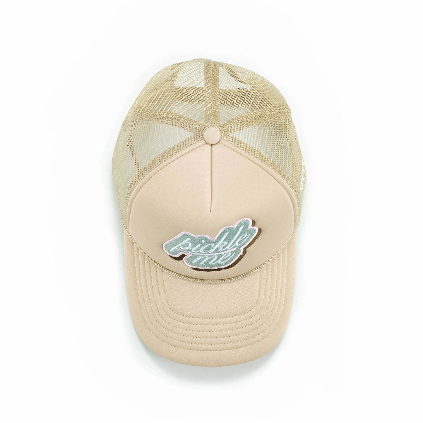 The ARTI Pickle Me Trucker Hat features a curved bill, light tan mesh back, and an embroidered “pickle me” patch in light blue and white. Shown from above on a white background.
