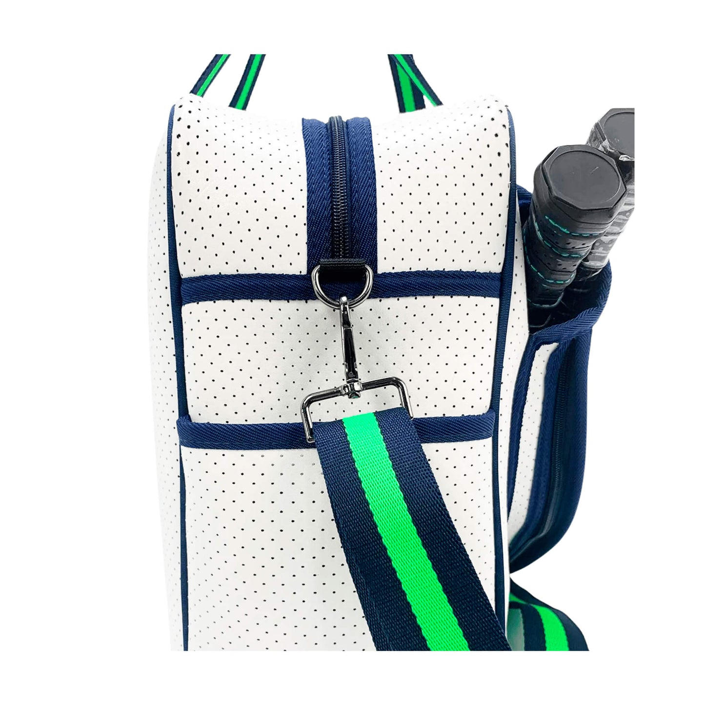 Close-up of the PickleballMonger Pickleball Bags White & Green, featuring white perforated neoprene, navy trim, a detachable green and navy striped strap, and outer pocket with visible zipper and metal clasp holding two paddle handles.