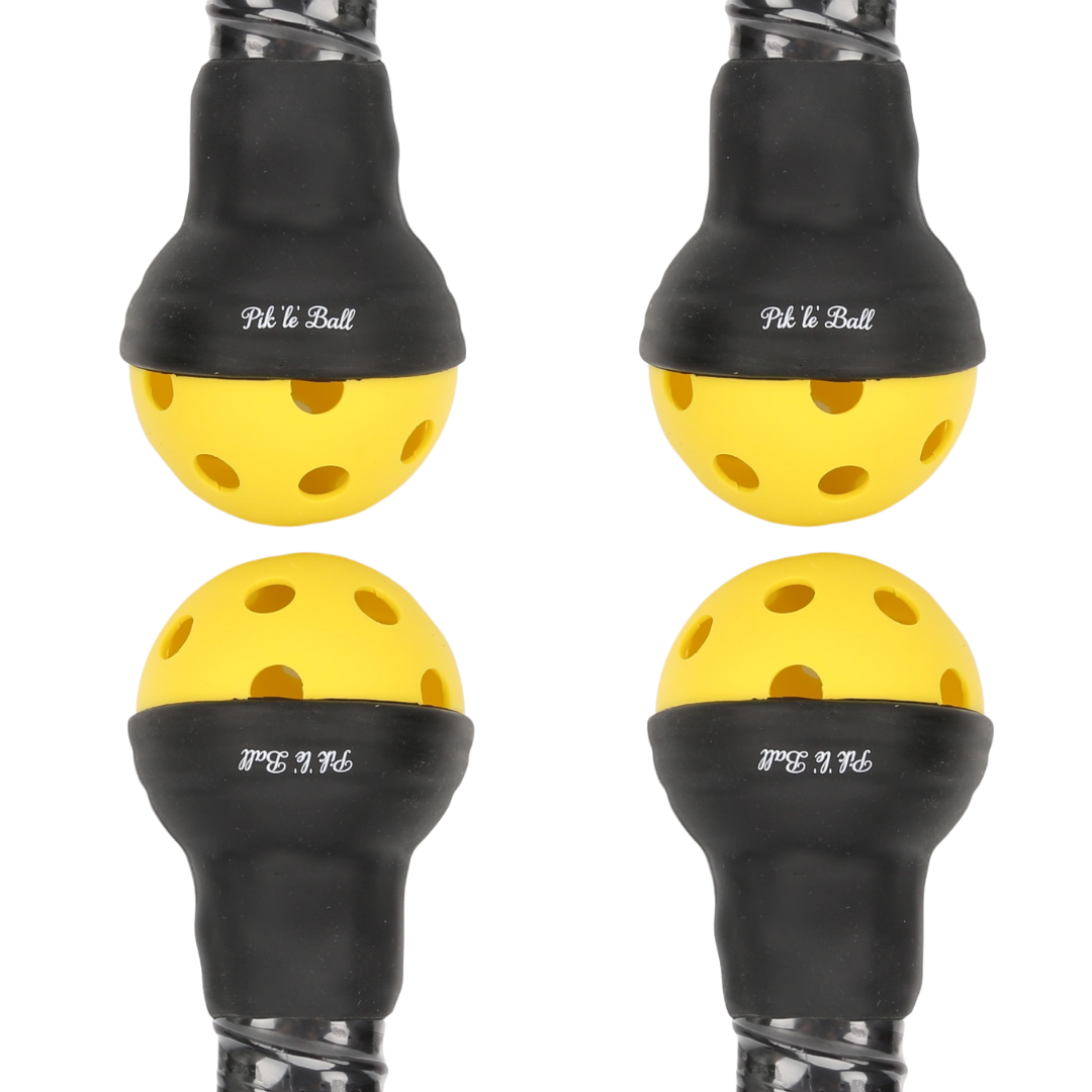 Four identical yellow balls with evenly spaced holes are partially encased in black rubber attachments labeled "Pik'le'Ball Sports." The Pik'le'Ball Ball Retriever accessory is arranged in a grid on a white background, handles extending out of frame.