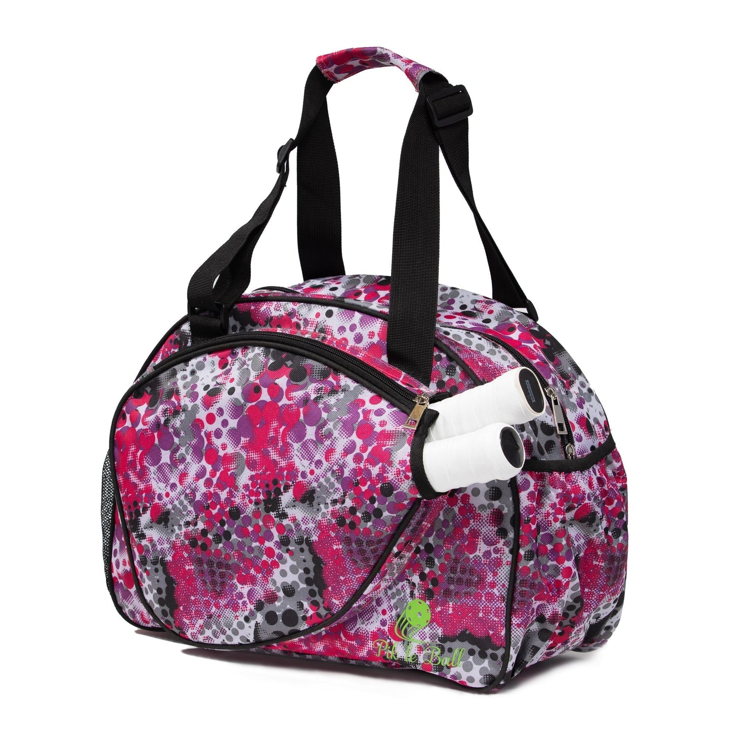 The Pink Dot Premium Women's Pickleball Bag by Pik'le'Ball Sports is round with pink, black, white, and gray patterns, black straps, a side pocket for two racquets, and a front green tennis ball logo labeled "Tennis Ball.