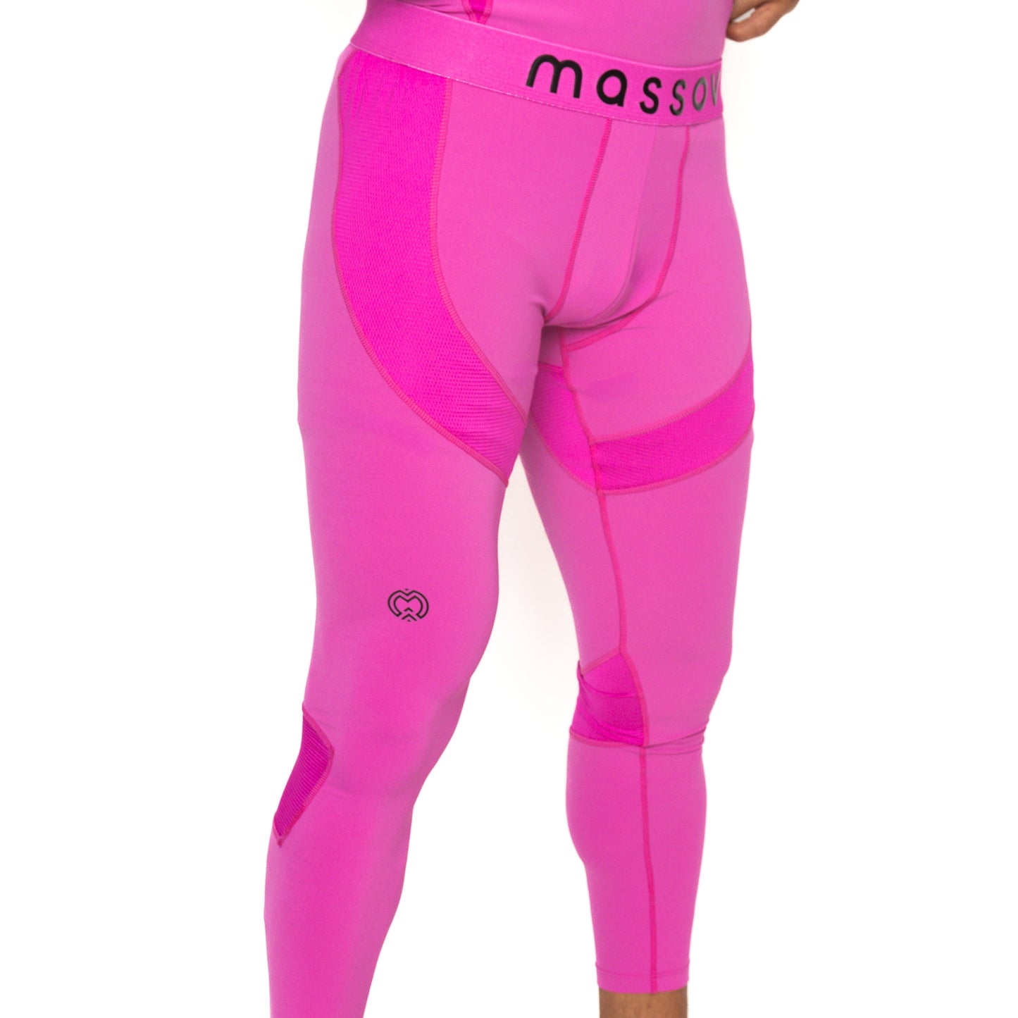 A person wears bright pink ProForm® Boys' Compression Pants by Massov, featuring a black "massov" waistband, panel designs, and a small heart logo on one thigh. Only the lower torso and legs are shown against a plain white background.