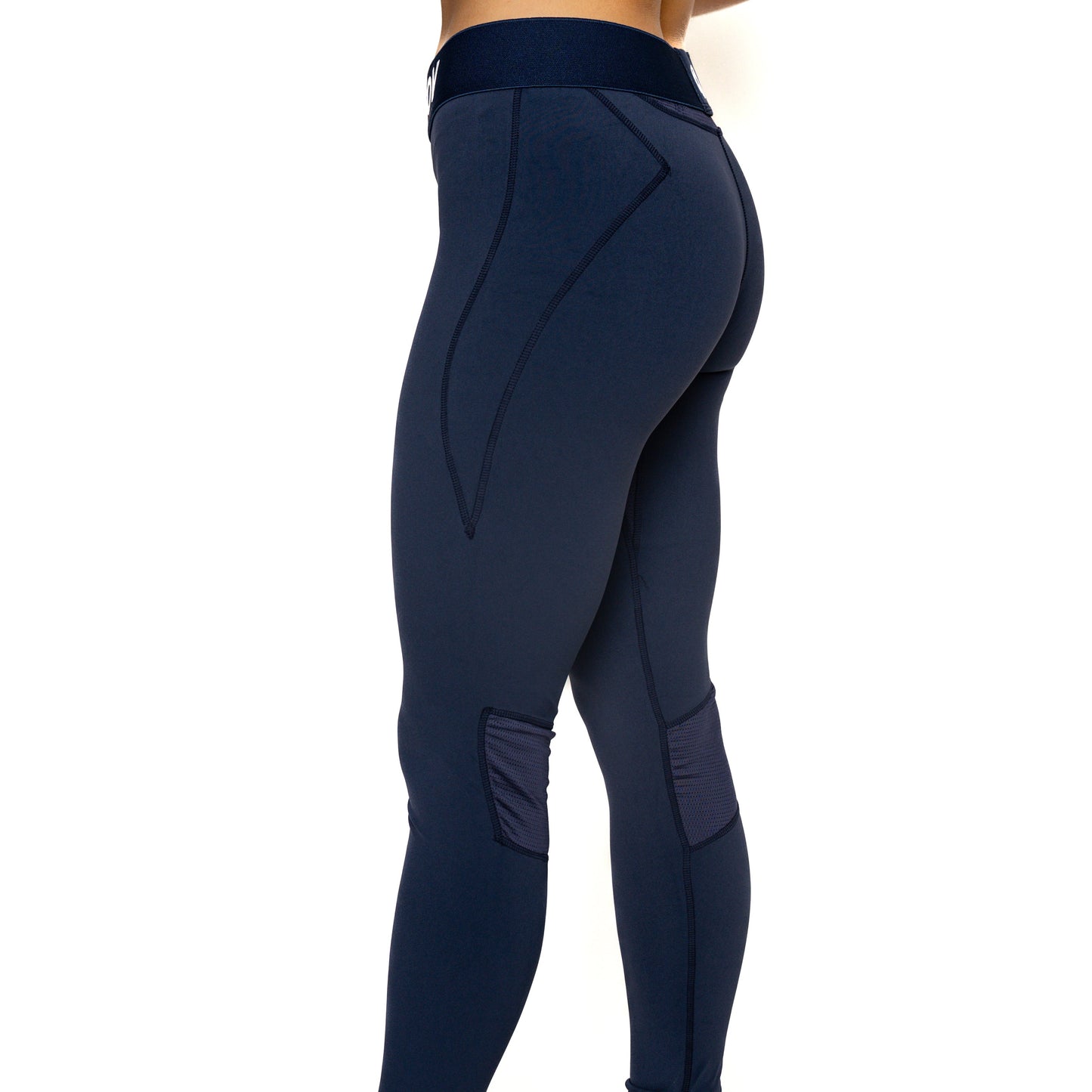 A person is shown from the waist down wearing Massov ProForm® Women's Compression Leggings in navy blue, featuring black seam detailing and textured knee patches, against a plain white background.