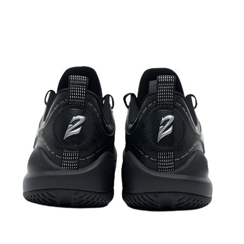 The Rigorer BP1 "Family Matters" basketball shoes by BPBazaar are shown from the back, featuring a silver Z logo above the heel, vertical dotted heel tabs, and textured soles. Their sporty style stands out against a plain white background.