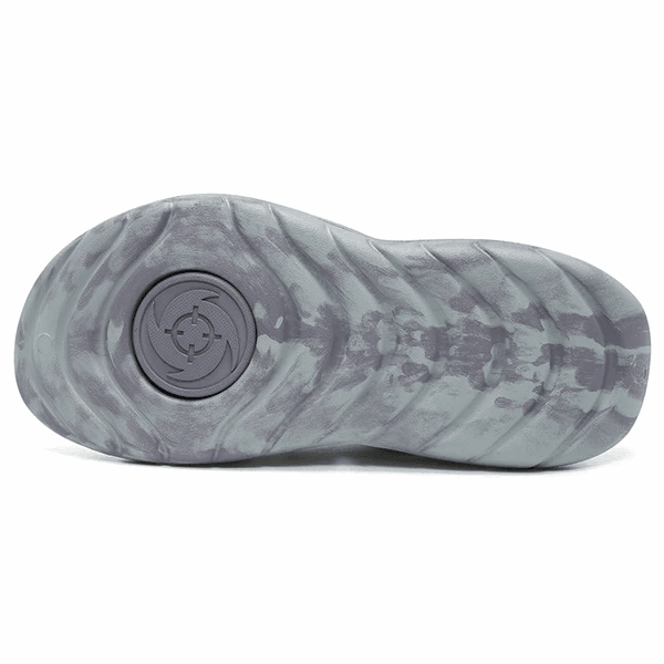 The image shows the bottom view of BPBazaar's Rigorer Shark 3 Slides 'Grey,' featuring a wavy textured gray sole and a circular area near the heel with concentric rings and a raised crosshair-like emblem.