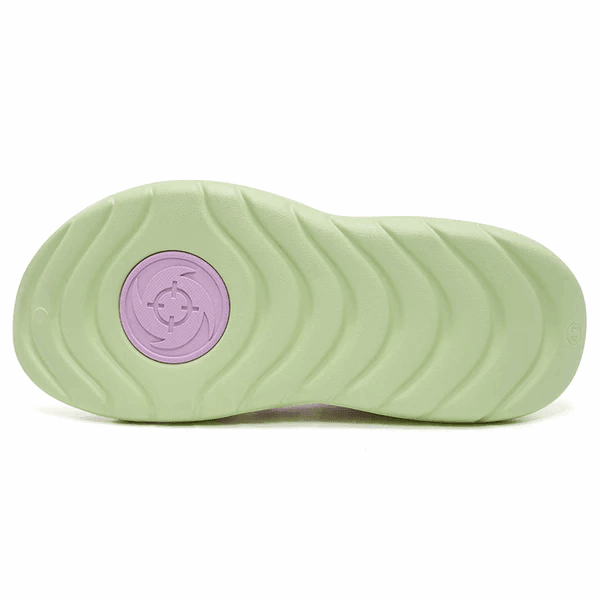 The image shows the sole of BPBazaar’s Rigorer Shark 3 Slides 'Pink/Green', featuring a wavy tread and light green base with a circular lavender design near the heel for a modern, sporty vibe.