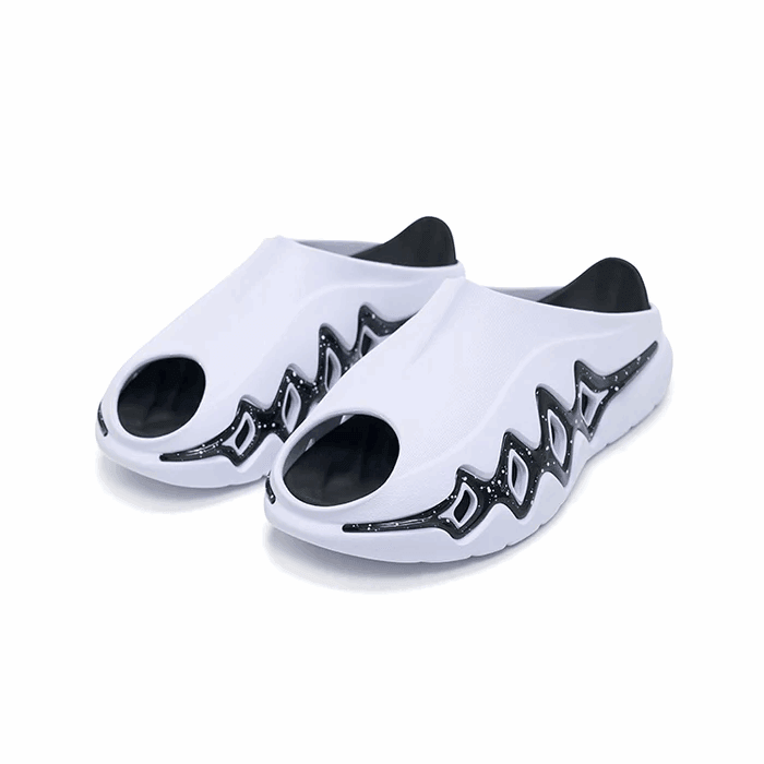 The BPBazaar Rigorer Shark 3 Slides 'White/Black' feature large toe holes, black zigzag sides with white dots resembling flames or waves, and a black interior and heel for a sporty, modern look.