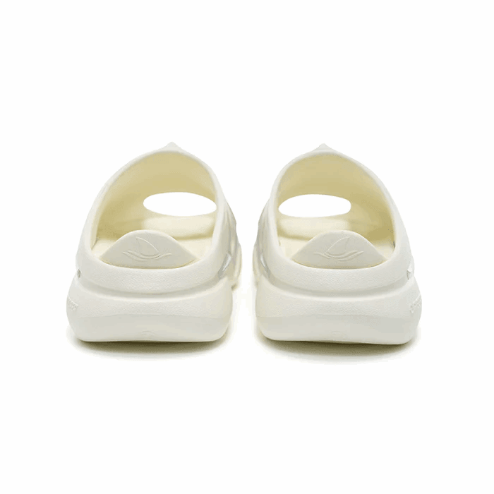 A pair of Rigorer Shark 3 Slides 'White/Pink/Blue' by BPBazaar seen from the back, showing an oval heel cutout and embossed leaf logo above the heel. Thick soles and a minimal, modern look pop against a plain white background.