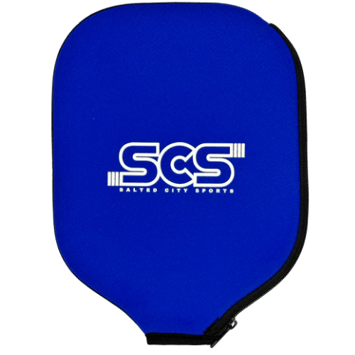 The Salted City Sports Pickleball Paddle Cover features a bright blue, rectangular, tapered design with a black zipper and bold white “SCS” logo and “Salted City Sports” text on the front, offering superior protection for your paddle.