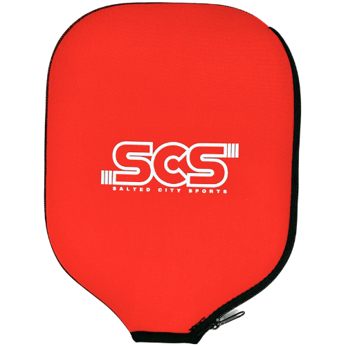 The Salted City Sports Pickleball Paddle Cover is bright red with a black border, zippered closure, and features a white SCS logo with "Salted City Sports" centered on the front. Its rounded shape provides stylish paddle protection.