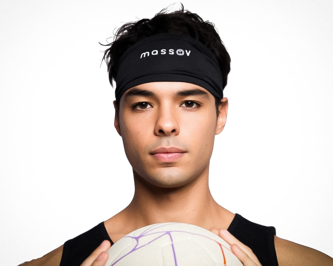 A young man with short dark hair wears a black Massov Skull Wrap and a sleeveless black shirt. He holds a white volleyball with purple and orange lines, looking directly at the camera against a plain white background.