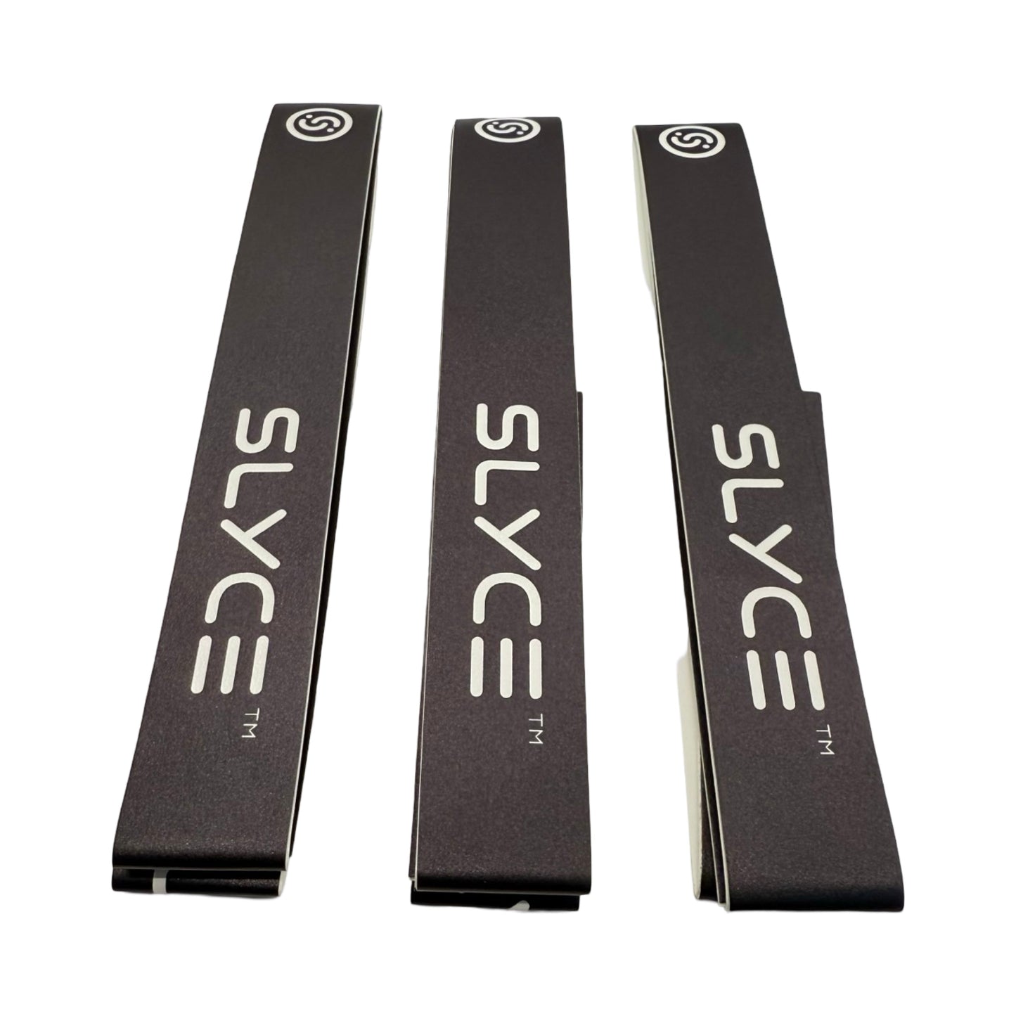 Three black SLYCE Signature Edge Guard Tape products by Slyce Sport are stacked vertically on a white background. Each features “SLYCE” in bold white letters, a circular logo near the top, and metallic paddle-protecting edges.