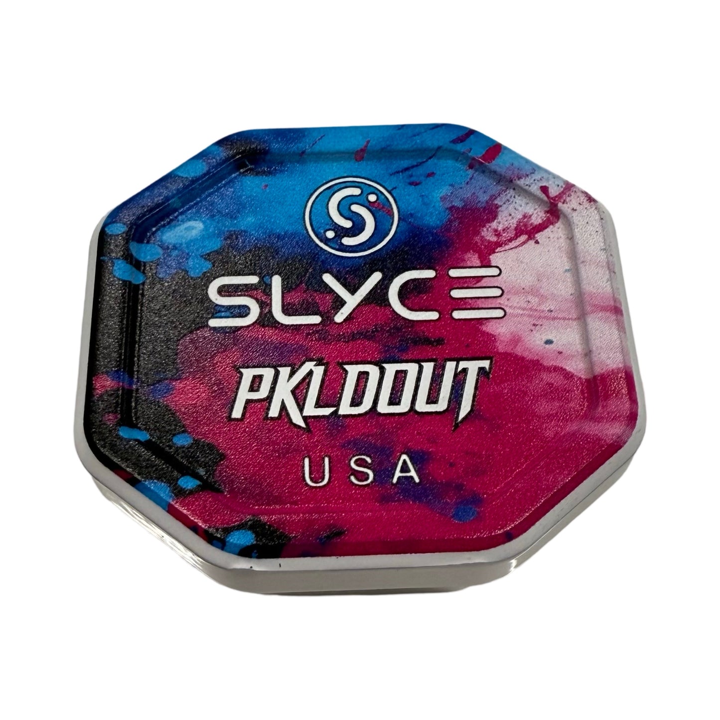 The Special Edition PKLDOUT Cotton Candy SpeedCap (28g, 1.0 oz.) by Slyce Sport is a colorful octagonal paddle performance enhancer with a blue and pink splatter, spiral “S” logo, white “SLYCE,” and bold “PKLDOUT USA” on a crisp white background.