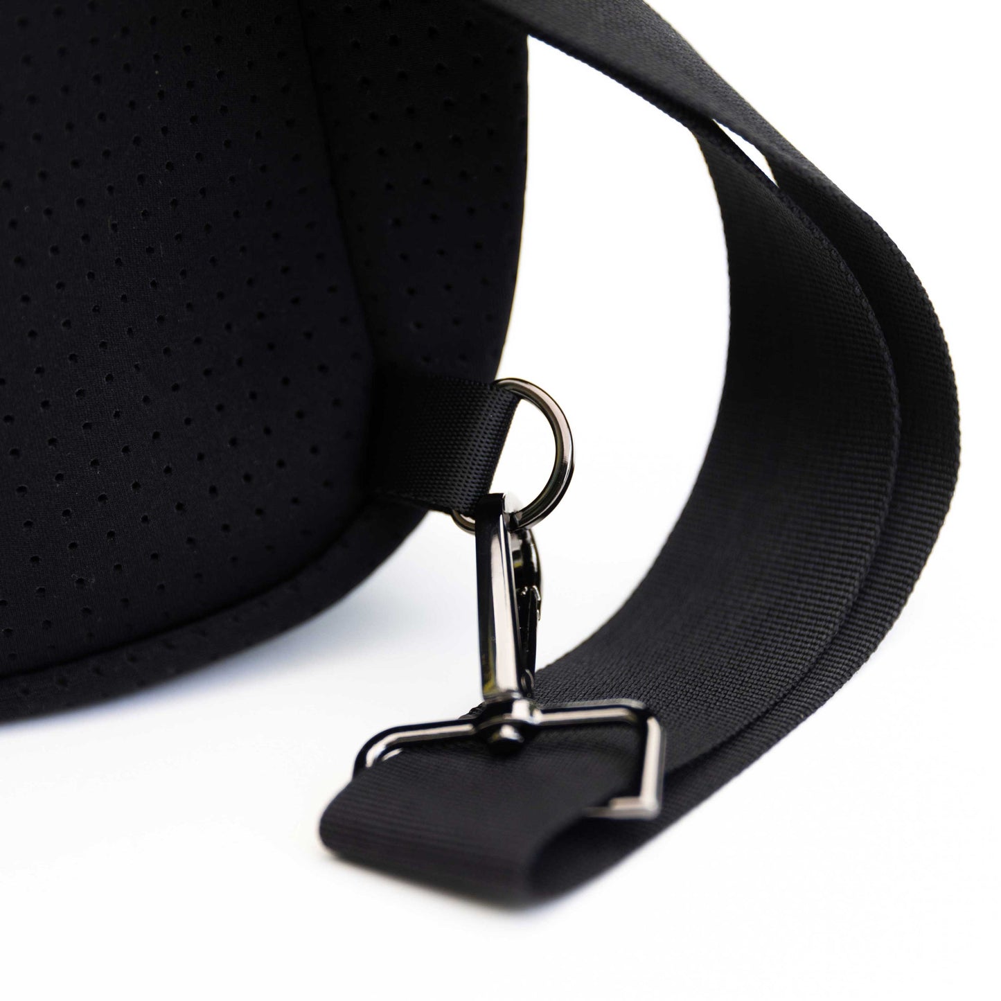 Close-up of the black neoprene strap and shiny hardware on the Swinton Pickleball Sling Bag - Black (Personalization Available), showing texture and details against a white background.