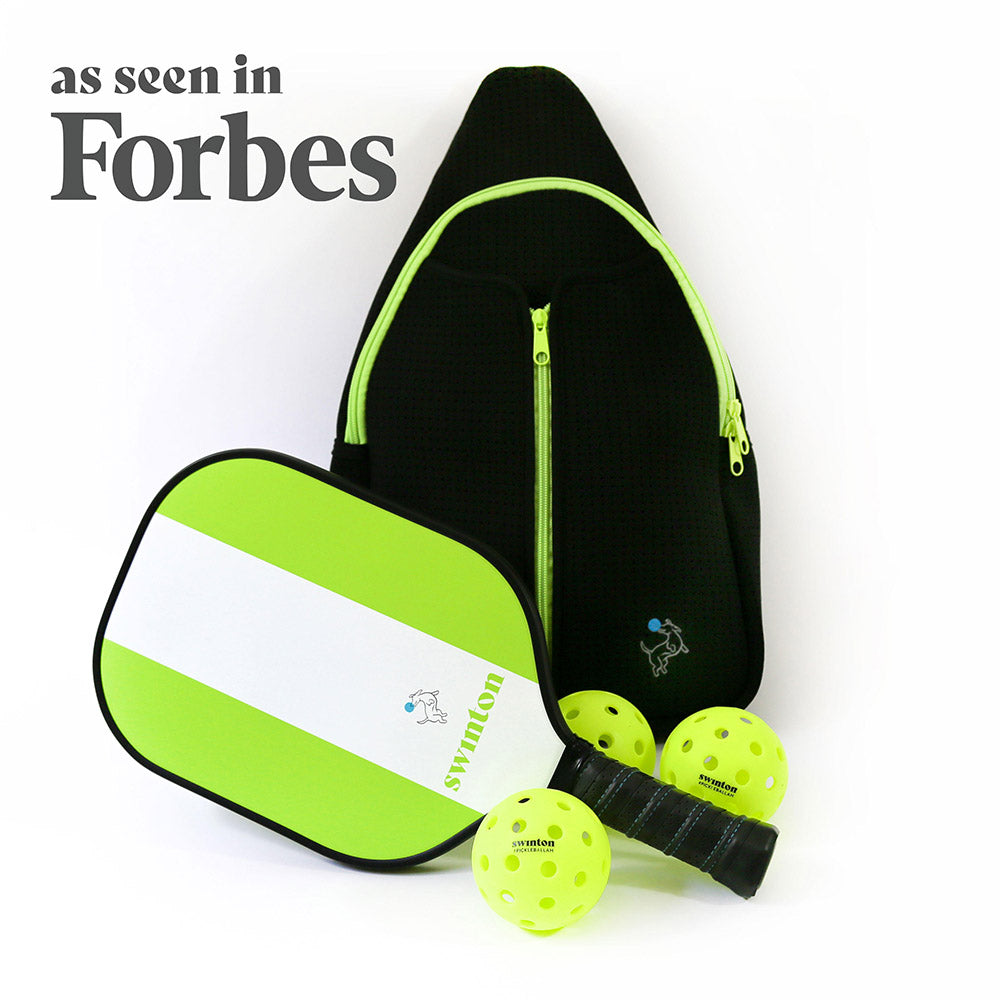 The Swinton Pickleball Starter Bundle - Black Sling Bag Combo includes a black zippered bag with yellow accents, a neon green and white paddle, and three yellow pickleballs—perfect for gifting. Both bag and paddle feature matching logos, as seen in Forbes.