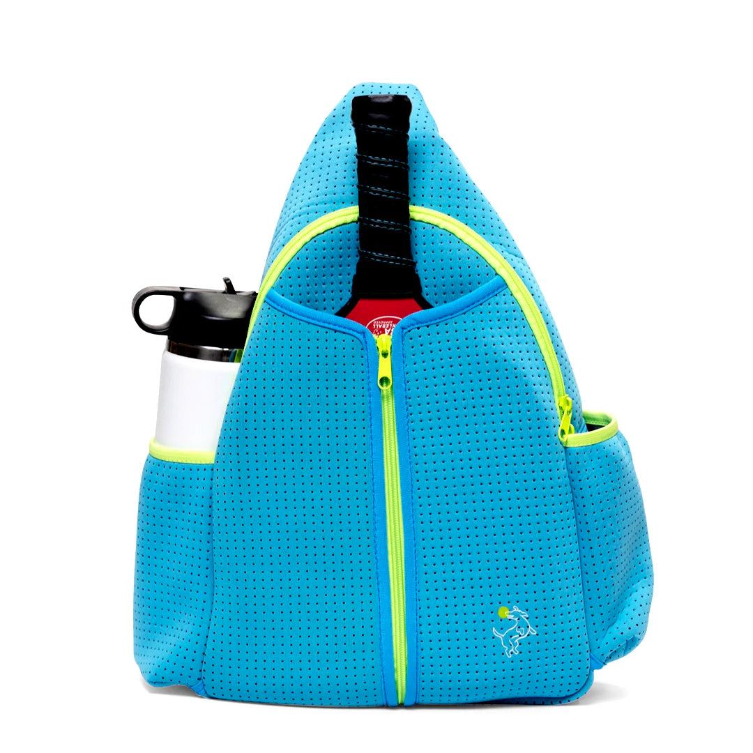 The Swinton Pickleball Sling Bag - Blue features a bright blue neoprene, triangular shape with perforated fabric, lime green zippers, and a yellow logo. The front zipper is partly open, showing a racket handle. Side pockets hold a white water bottle and more.