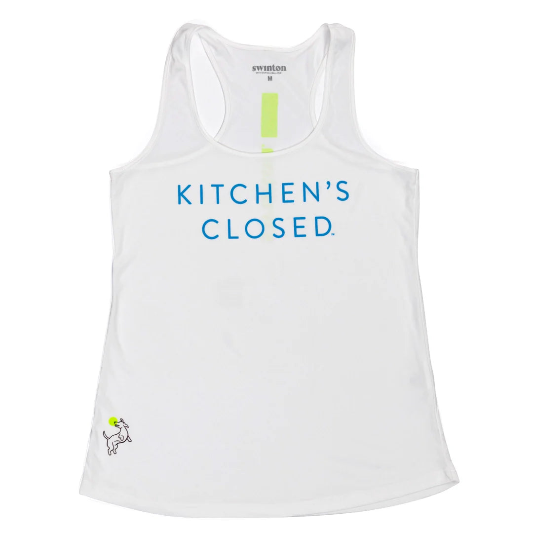 The Swinton Pickleball Performance Tank White features blue "KITCHENS CLOSED" text centered on the front, a cartoon goat in a green chef’s hat at the hem, and signature branding with a yellow stripe inside the neckline.