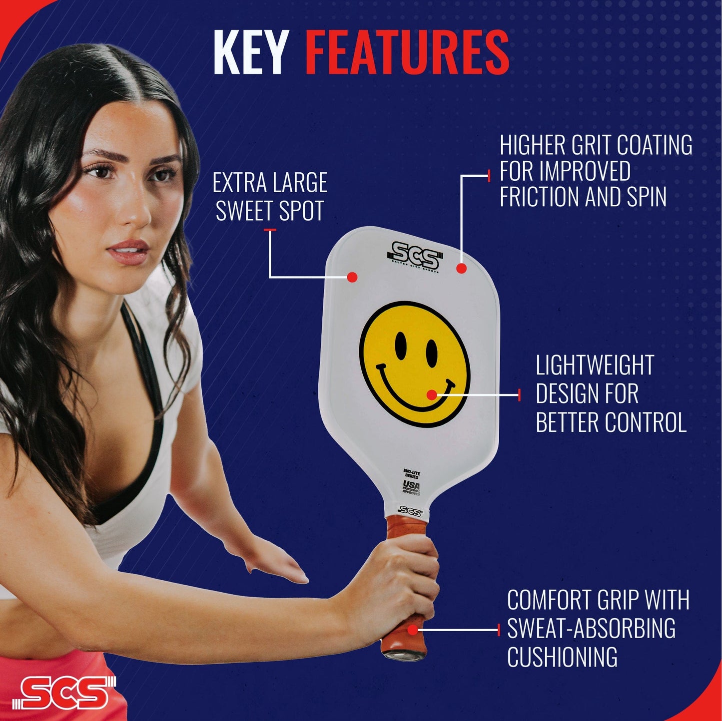 A woman holds The Happy Paddle | Evo-Lite Series by Salted City Sports, featuring an extra-large sweet spot, high-grit spin coating, lightweight control, sweat-absorbing comfort grip. USA Pickleball approved. Blue with red accents; big smiley face graphic.