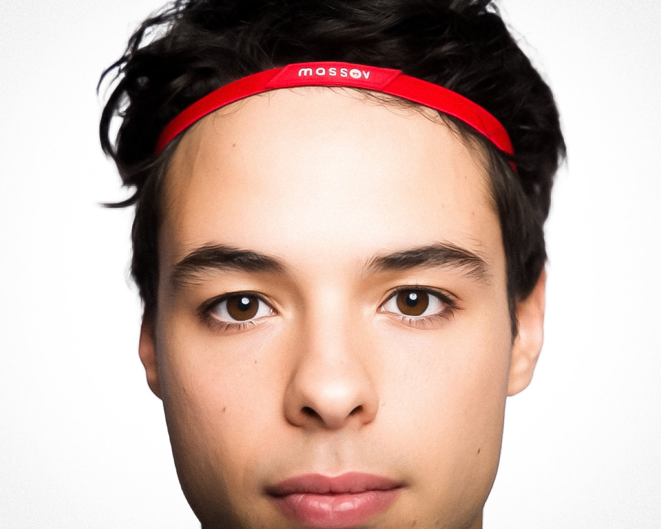 A young person with short, dark hair wears a Massov Thin Sports Headband in red, looking directly at the camera against a plain white background with a neutral expression.