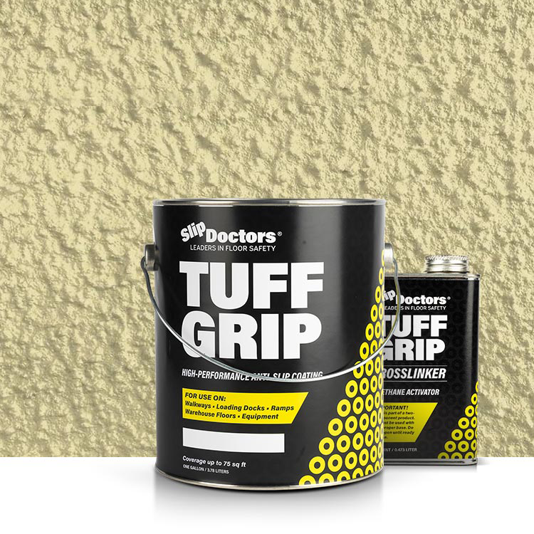 A large black can of SlipDoctors Tuff Grip or Tuff Grip Extreme Aggressive Traction Non-Skid Floor Paint sits before a smaller TUFF GRIP CROSS LINKER container; both have yellow and white text against a textured, sand-colored wall.