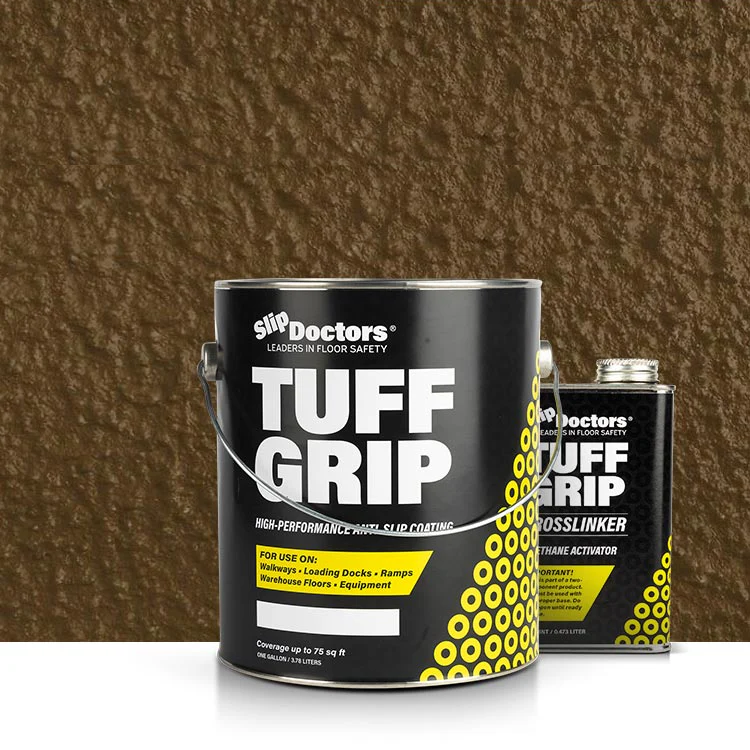 A large black and yellow SlipDoctors Tuff Grip Aggressive Traction Non-Skid Floor Paint can stands beside a smaller Crosslinker container on a white surface, set against a textured brown wall in the background.