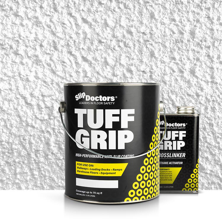 A large black can of Tuff Grip or Tuff Grip Extreme Aggressive Traction Non-Skid Floor Paint sits by a smaller SlipDoctors Crosslinker can, both featuring SlipDoctors branding against a textured white wall.