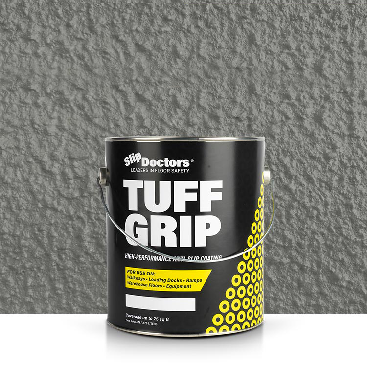 A black can of SlipDoctors Tuff Grip or Tuff Grip Extreme Aggressive Traction Non-Skid Floor Paint with a metal handle sits on a white surface, featuring bold text and yellow circles. The background shows a textured, gray non-skid paint finish.