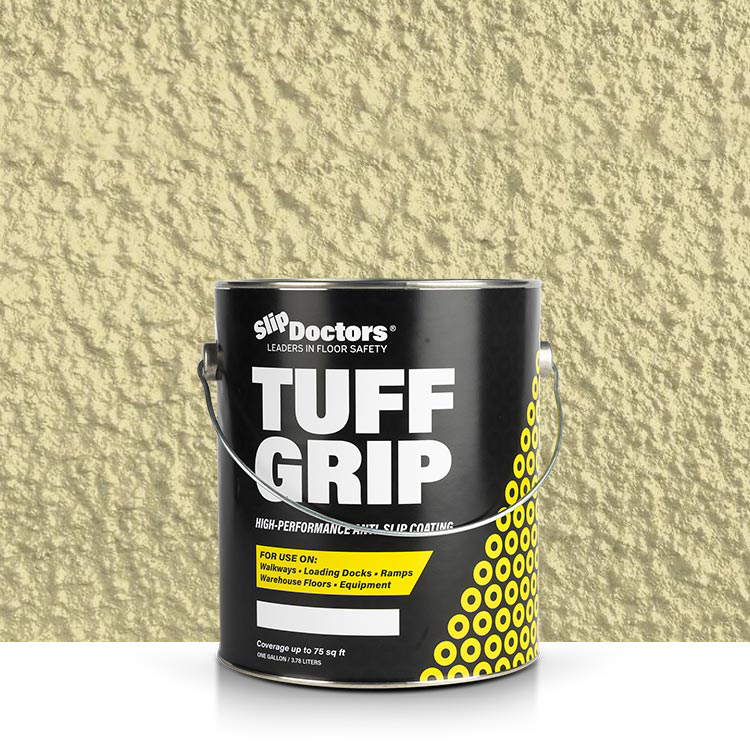 A black 1-gallon can of SlipDoctors Tuff Grip or Tuff Grip Extreme Aggressive Traction Non-Skid Floor Paint sits on a light surface, accented by yellow dots and a slanted stripe against a textured yellow-beige wall.