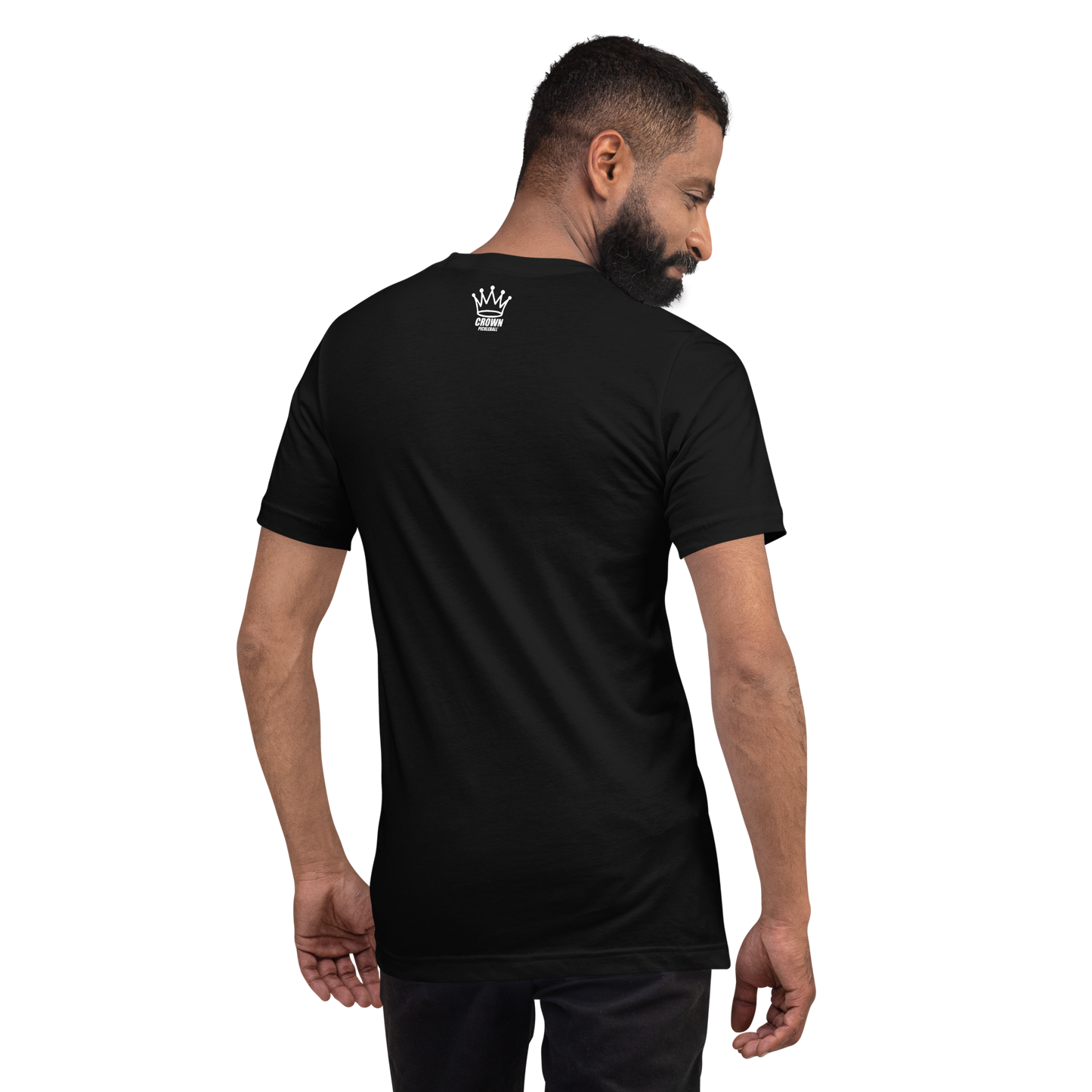 A bearded man faces away from the camera, wearing the Crown Pickleball PICKLEBALL MANUFACTURERS ASSOCIATION Logo Shirt (Black), a 100% cotton tee with a small white crown logo and text on the upper back, set against a plain white background.
