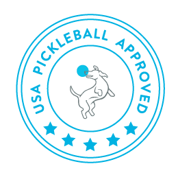 A circular blue stamp reads “USA Pickleball Approved.” Inside, a line drawing shows a dog jumping to catch a pickleball—perfect for fans of Swinton Pickleball’s Hero Bananas Paddle. Five stars line the bottom edge of the circle.