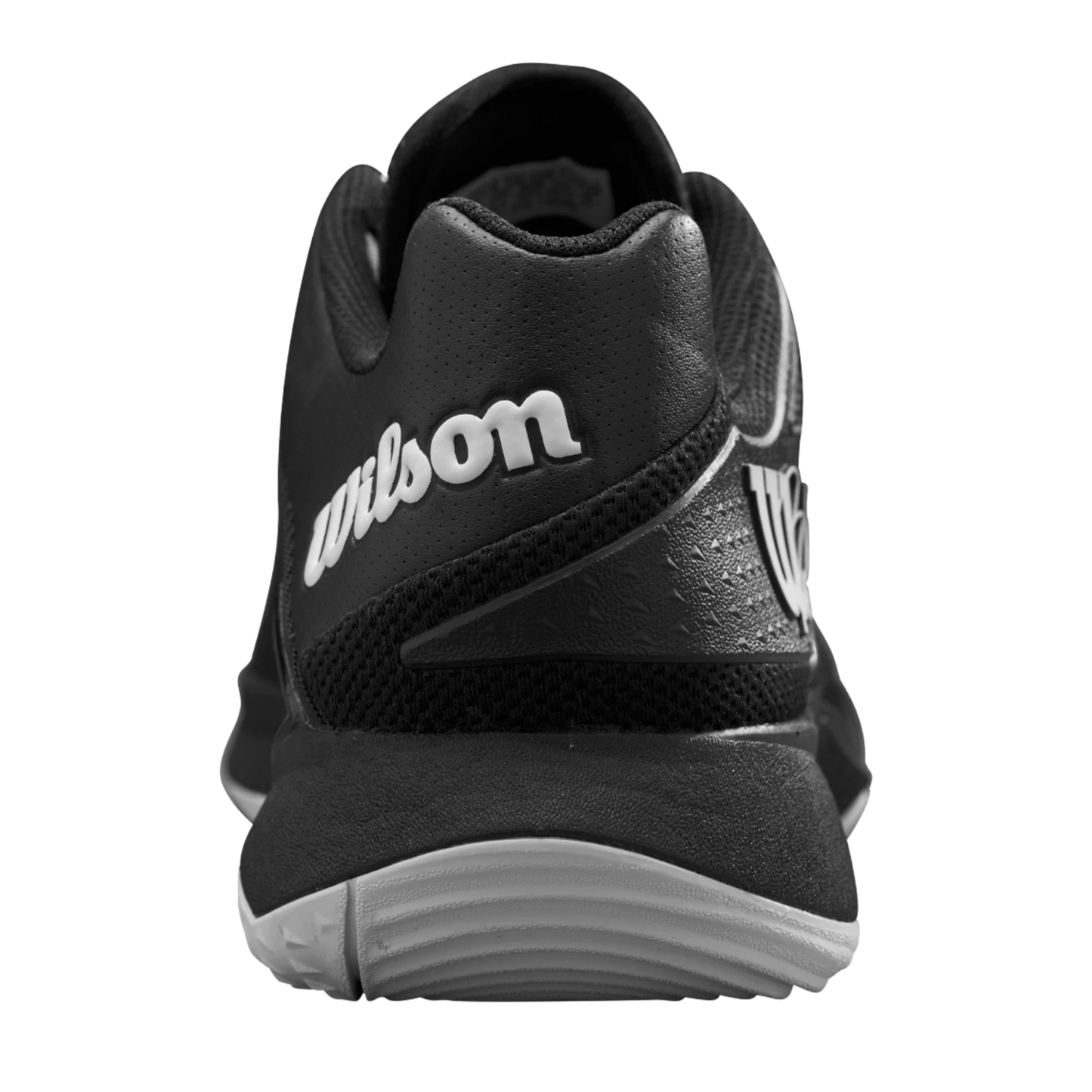 Close-up rear view of Wilson Bela Tour Men's Padel Shoes by Padel USA, featuring black textured mesh, visible stitching, a white and gray sole, and photographed against a plain light gray background.