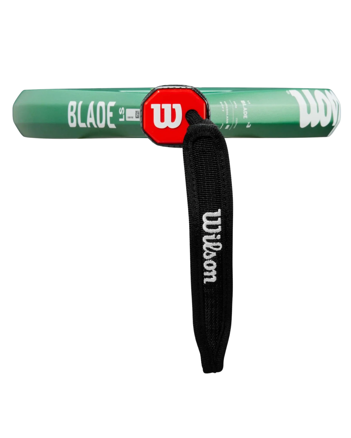 A close-up of the Wilson Blade LS V3 tennis racket handle from Padel USA shows a green grip with a red hexagonal cap, white W logo, black strap, and “BLADE IS” printed in white on the side for lightweight power.
