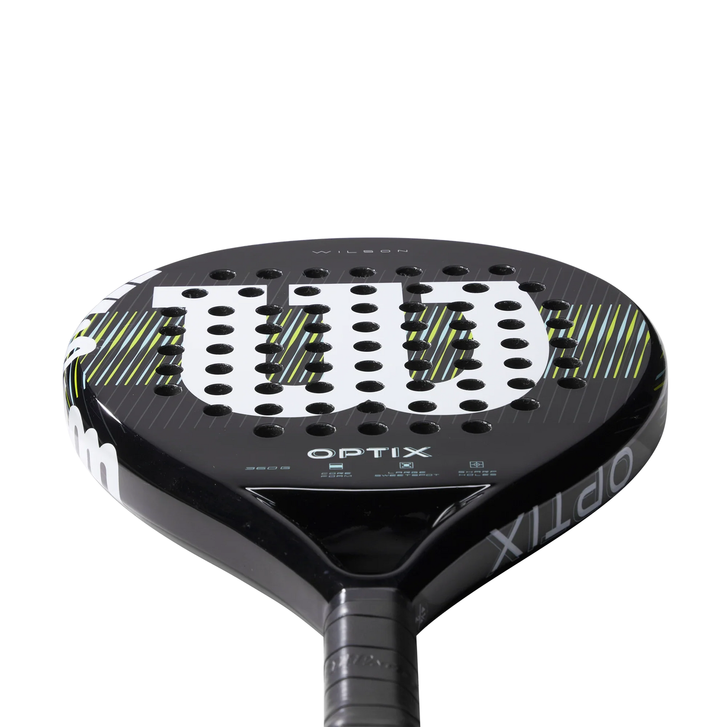 Close-up of the Wilson Optix V1 Black Padel Racket by Padel USA, featuring a large white W logo, small circular holes on the face, and yellow and green diagonal lines, shown against a plain white background.