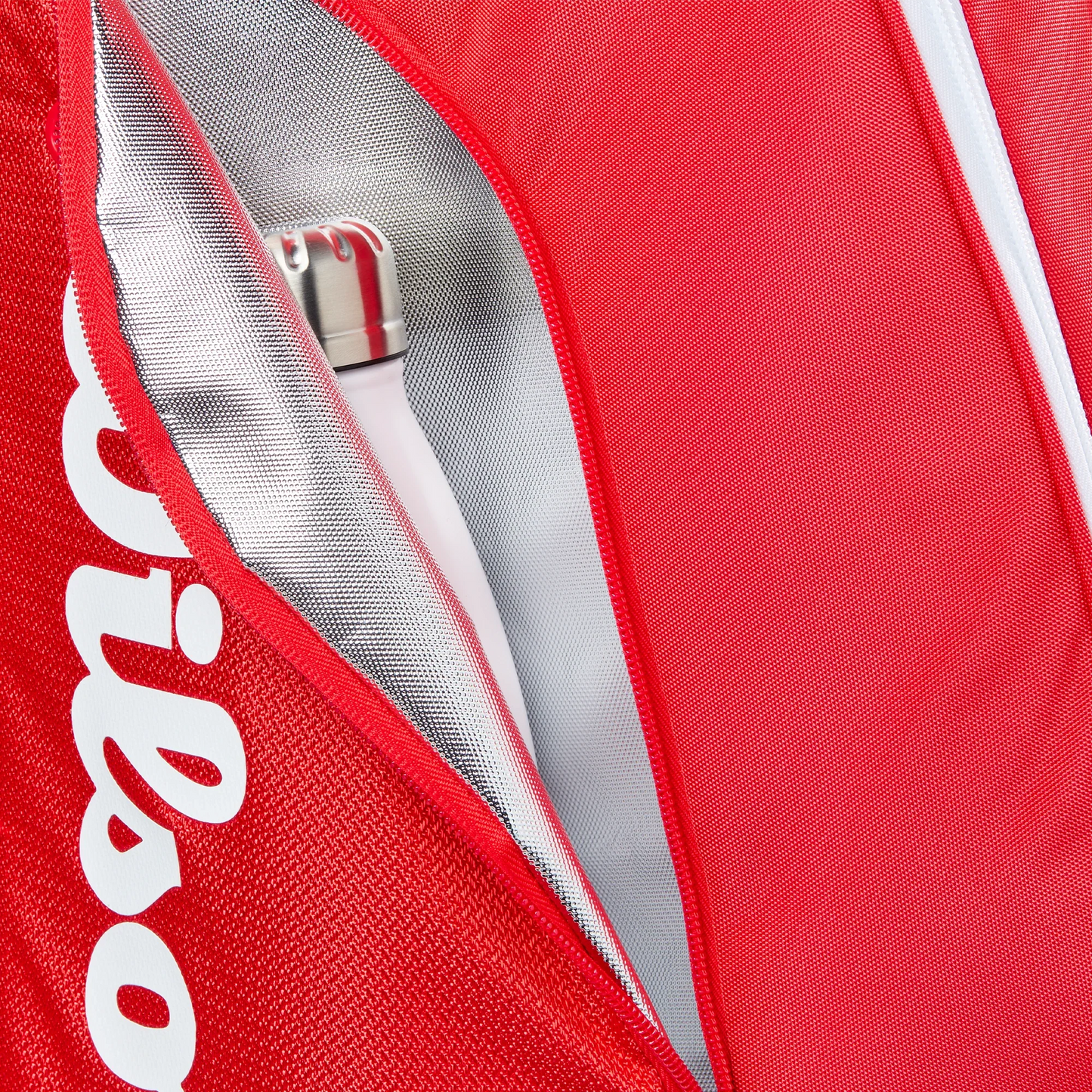 A close-up of the Wilson Tour Red Padel Bag by Padel USA shows its white zipper partially open, revealing a metallic water bottle and a silver inner lining with Thermoguard technology. The white Wilson logo is also partially visible.