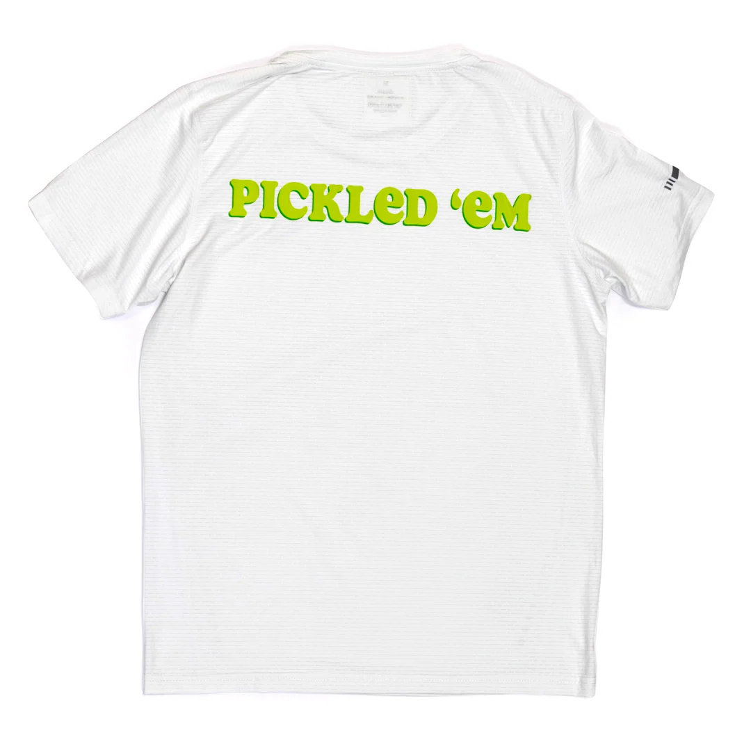 The Swinton Pickleball Women's Pickled 'em LUX Performance Shirt is a white short-sleeve tee featuring bold green-yellow "PICKLED EM" text on the back, crafted from soft performance material with a clean, logo-free design.