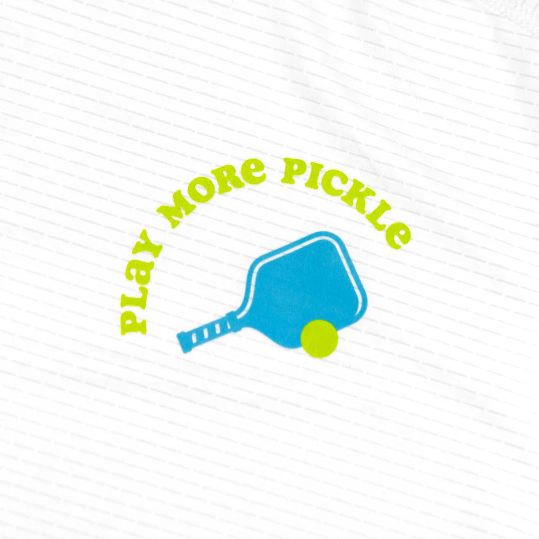 The Swinton Pickleball Women's Pickled 'em LUX Performance Shirt features PLAY MORE PICKLE in bold, curved green letters above a blue paddle and green ball on white ribbed fabric, available in women's styles.